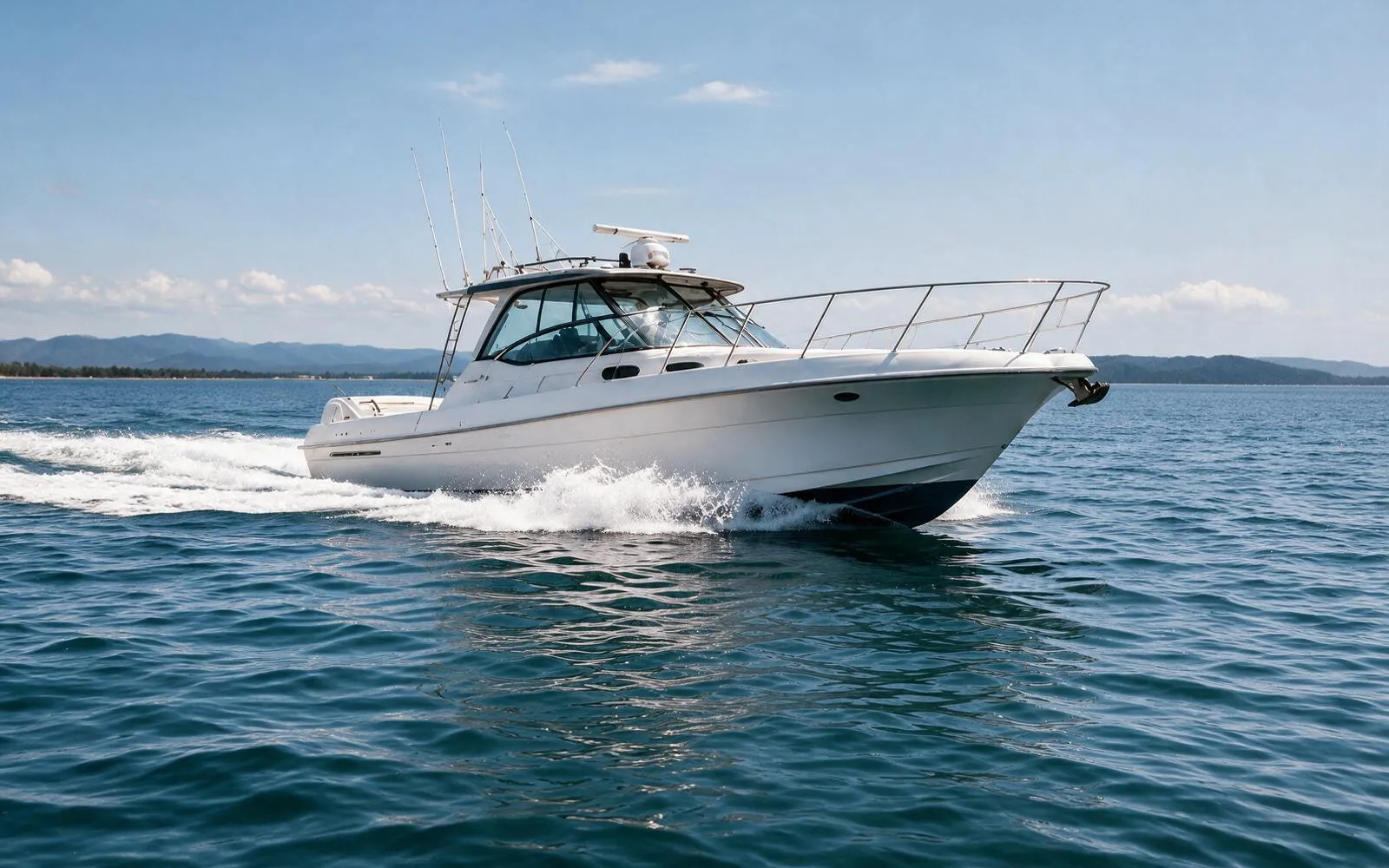 A boat powering away across open water
